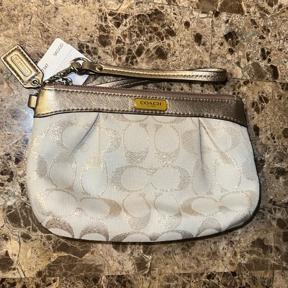 Coach Handbags - NWT Coach Signature Wristlet